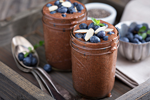 chocolate chia pudding topped with blueberries.