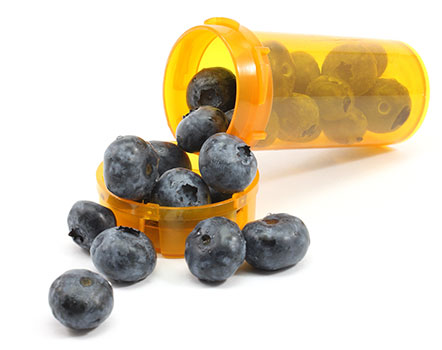 A pill bottle that contains blueberries instead of medicine.